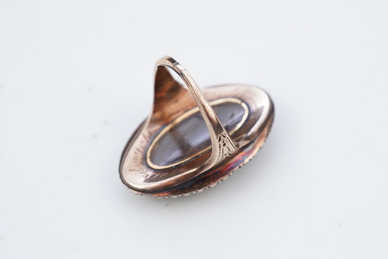 A fine George III seed pearl, enamel and diamond mourning ring, circa 1782